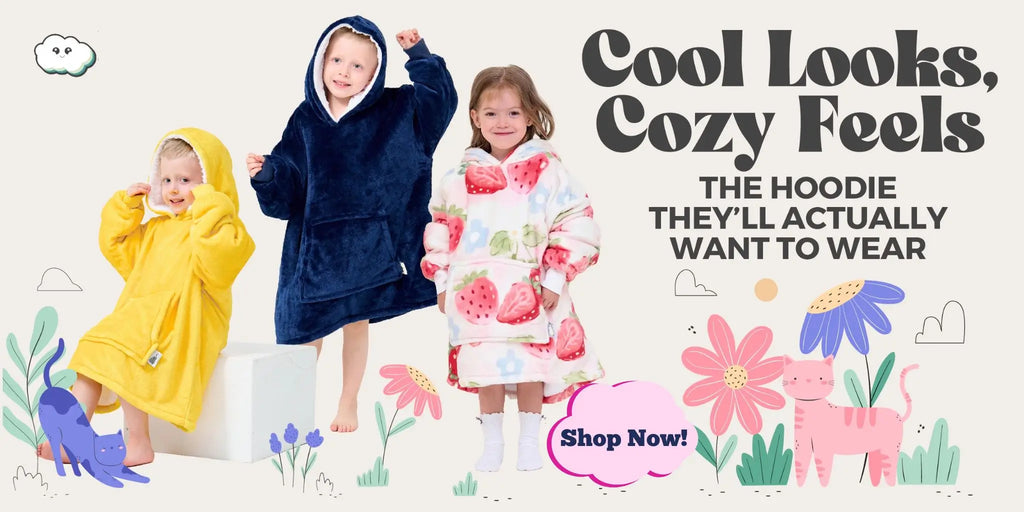 Three toddlers wearing oversized fleece hoodies in yellow, navy, and strawberry prints from Hoodie Haven, standing in a playful floral scene with the text “Cool Looks, Cozy Feels”.
