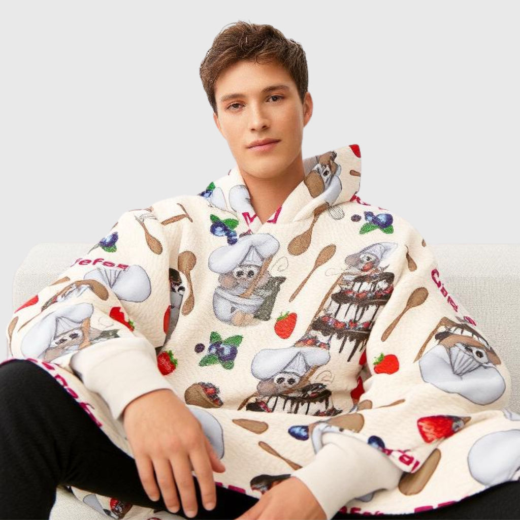 Man sitting wearing cozy Mouse Chef printed hoodie blanket